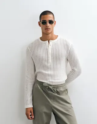 ASOS DESIGN regular long sleeve henley T-shirt in white textured fabric