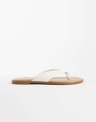 schuh Thailand flip flops in white faux leather