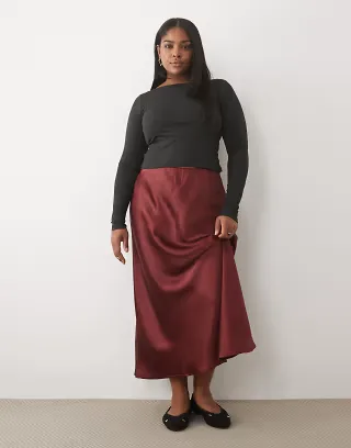 ASOS DESIGN Curve satin bias maxi skirt in burgundy