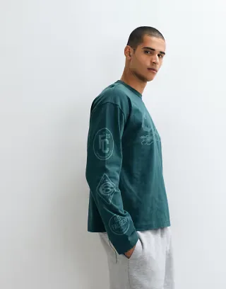 ASOS DESIGN boxy oversized long sleeve t-shirt with text graphic in green wash