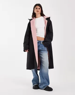ASOS DESIGN longline rain coat in black with pink borg liner