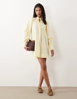 ASOS DESIGN high neck tie poplin mini dress with puff sleeve in tender yellow