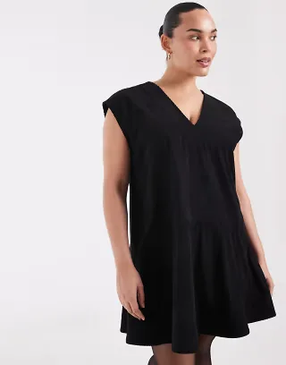 ASOS DESIGN Curve relaxed V-neck mini dress with dropped waist in cord in black
