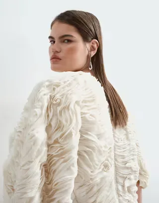 ARRANGE Curve volume sleeve curved hem textured top in ivory