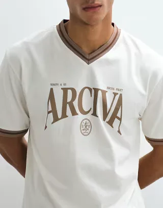 ASOS DESIGN relaxed ringer t-shirt with arciva graphic in cream