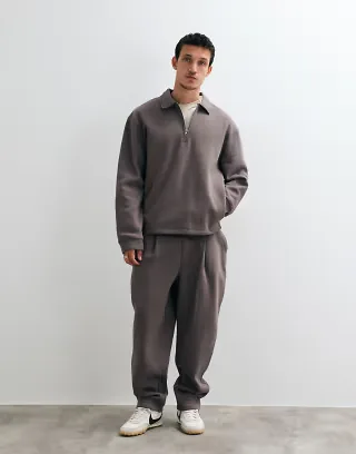 ASOS DESIGN relaxed long sleeve polo and tapered sweatpants with pleats set in charcoal