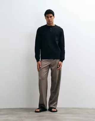 ASOS DESIGN regular fit long sleeve t-shirt with henley neck in black waffle knit