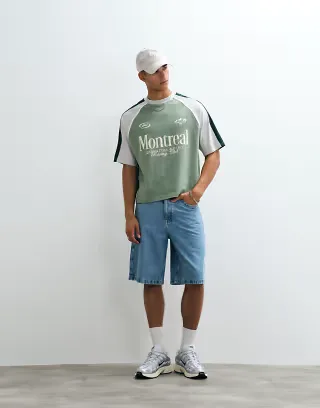 ASOS DESIGN boxy oversized cut and sew T-shirt with soccer graphic in green