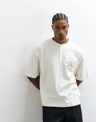 ASOS DESIGN boxy oversized henley t-shirt with text chest graphic in white