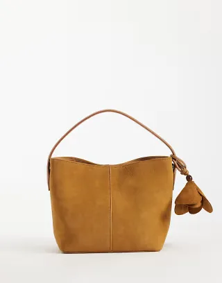 ASOS DESIGN faux suede grab bag in tan with detachable cross body strap with floral bag charm