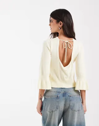 ASOS DESIGN knit flared sleeves and bow back sweater in butter yellow