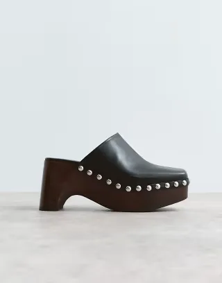 ARRANGE leather studded clogs in black