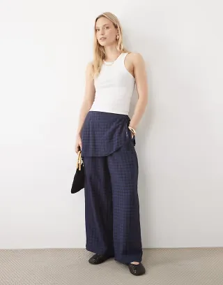 ASOS DESIGN Petite straight leg pants with skirt detail in navy gingham