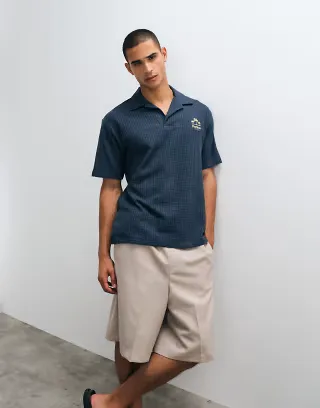ASOS DESIGN heavyweight relaxed polo shirt with chest embroidery in navy seersucker stripes