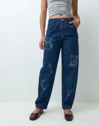 Muse Assembly charm printed baggy jeans in indigo