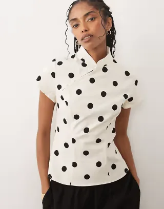 ASOS DESIGN mandarin collar with asymmetric button detail top in cream polka dot print