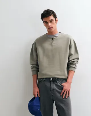 ASOS DESIGN heavyweight oversized sweatshirt with henley neck in green