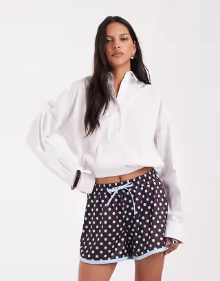 ASOS DESIGN satin polka dot mini shorts in blue mix spot