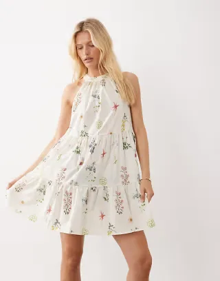 VILA halter neck tiered mini dress in cream floral print