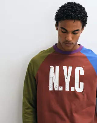 ASOS DESIGN oversized boxy washed raglan long sleeve henley with NYC print in burgandy