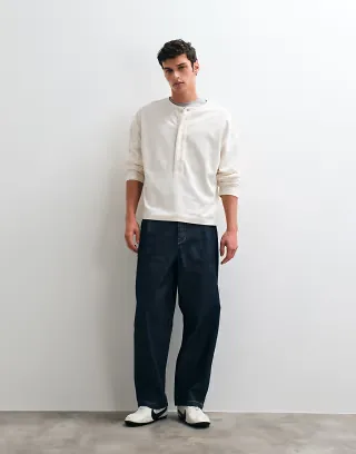 ASOS DESIGN heavyweight boxy oversized long sleeve t-shirt with henley neck in cream