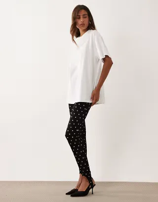 ASOS DESIGN interlock stirrup leggings in black polka dot print