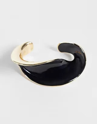 ASOS DESIGN cuff bracelet with twisted design in black enamel and gold tone
