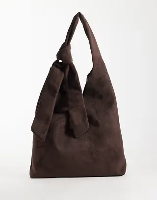 ASOS DESIGN faux suede cross over seam tote bag with metal ring hardware in chocolate