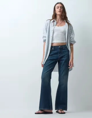 COLLUSION X005 relaxed bootcut jeans in 90s slubby dark wash