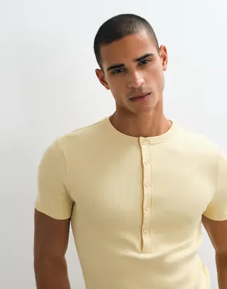 ASOS DESIGN muscle fit T-shirt with henley in yellow rib