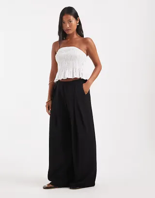 ASOS DESIGN Petite textured wide leg pants with tie waist in black