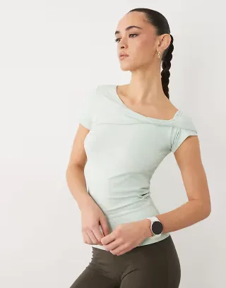 4505 plush feel asymmetric drape detail cap sleeve studio top in pistachio