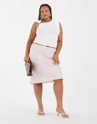 ASOS DESIGN Curve satin 90s bias cut skirt in pink polka dot print