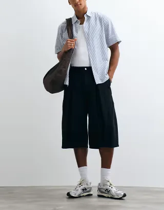 Reclaimed Vintage oversized jorts in black denim