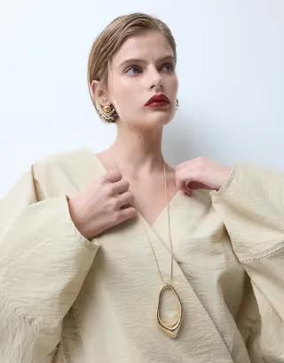 ASOS DESIGN long necklace with abstract pendant in gold tone