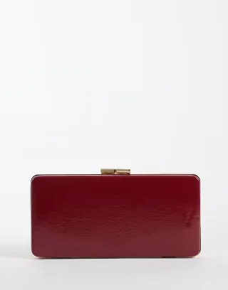 True Decadence clutch bag in deep red