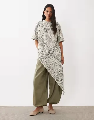 ASOS DESIGN crew neck asymmetric ruffle hem top in print