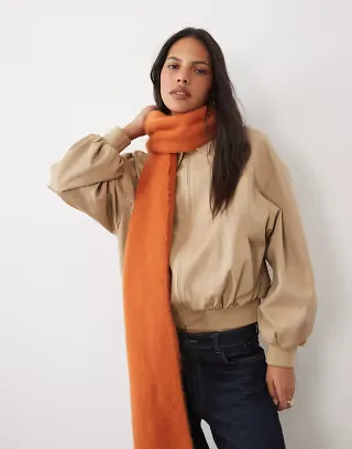 ASOS DESIGN woven fluffy tassel scarf in burnt orange