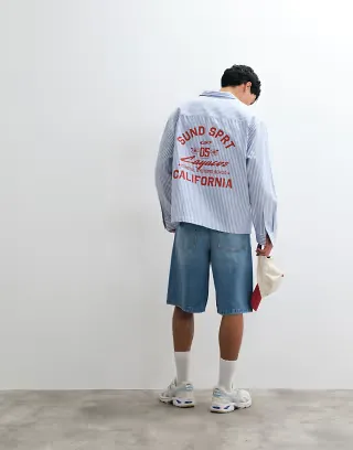 ASOS DESIGN oversized oxford shirt with chest print in blue stripes