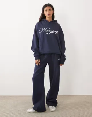 Kaiia cotton rich embroidered New York script logo oversized hoodie and sweatpants in navy