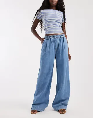 ASOS DESIGN wide leg pull on jeans in midwash blue