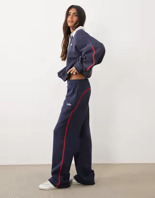 Kaiia cotton rich embroidered logo detail side stripe wide leg sweatpants in navy and red - part of a set