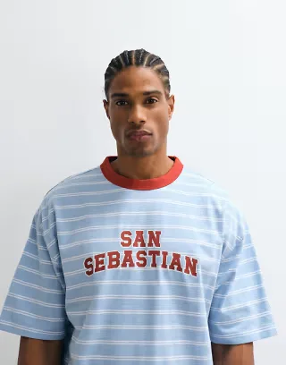 ASOS DESIGN boxy oversized T-shirt with contrast front graphic in blue stripes