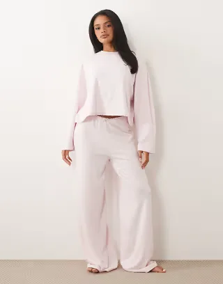ASOS DESIGN soft jersey wide leg pajama pants with floral trim in soft pink