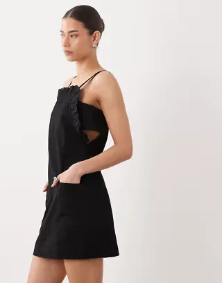 ASOS DESIGN pinny mini dress with pockets and ruffles in black