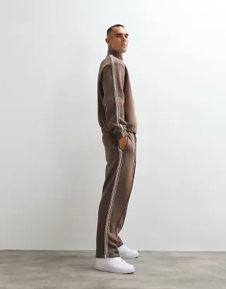ASOS DESIGN straight leg sweatpants with woven tape in brown