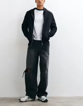 ASOS DESIGN baggy jeans in washed black with rips and elasticated waist