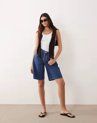 ARRANGE loose fit longline shorts in mid wash blue