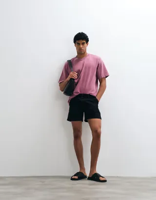 ASOS DESIGN chino shorts in black with pleats