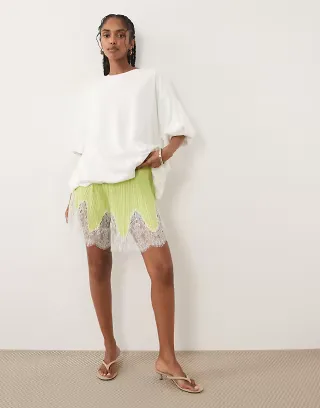 ASOS DESIGN mix & match plisse shorts in green with white lace hem